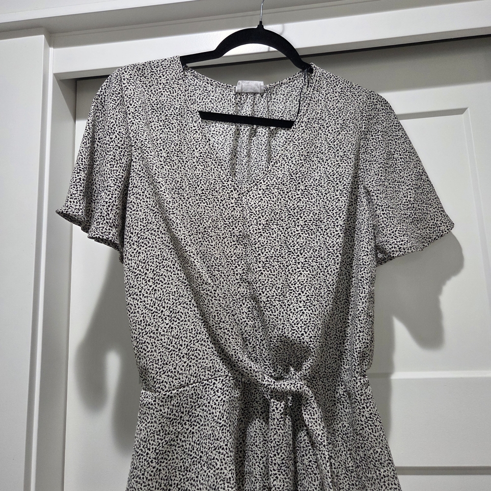Elegant Black and White Wrap Blouse